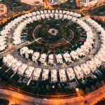 Aerial view of circular villa community in Jumeirah Village Circle, a prime location to buy land downtown Dubai.
