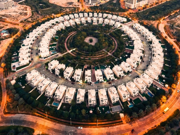 Aerial view of circular villa community in Jumeirah Village Circle, a prime location to buy land downtown Dubai.