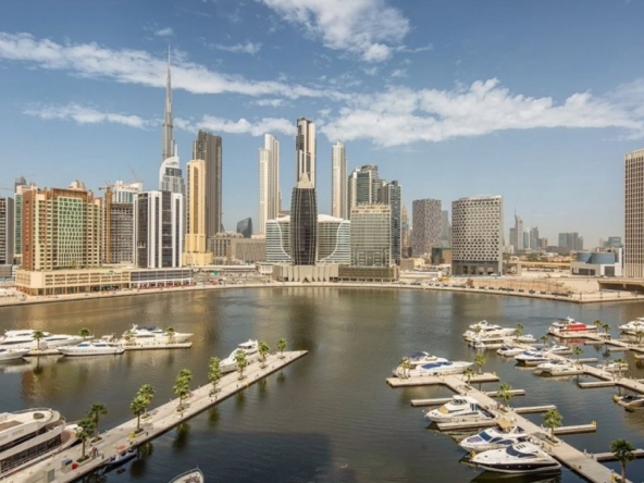 Panoramic view of Dubai Canal and Downtown skyline showcasing premium listings managed by a top Realestate agency in Dubai.