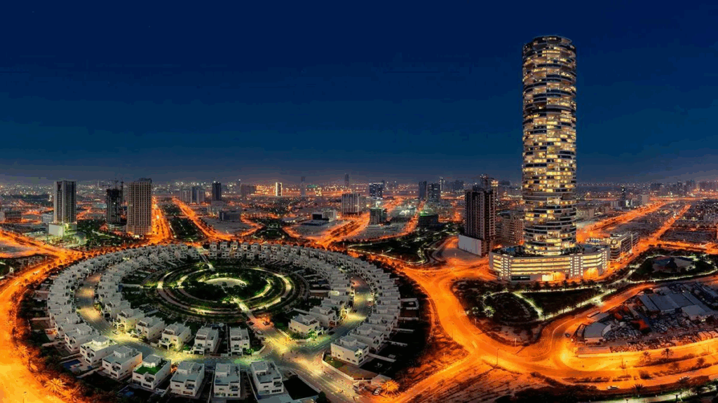 Panoramic view of modern residential buildings and circular villas in Jumeirah Village Circle — ideal area to buy land downtown Dubai.