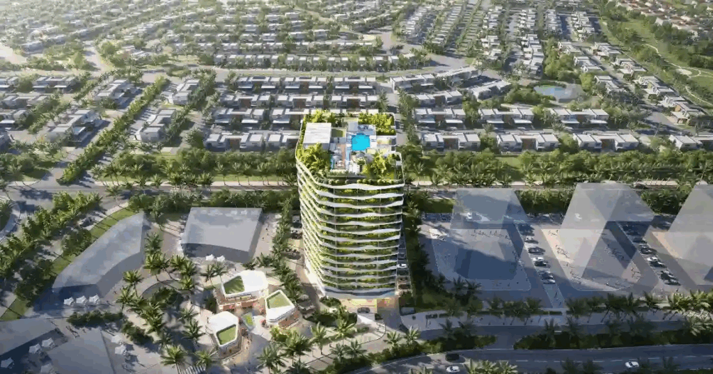 Buy land in Dubai Land Residence Complex aerial view of residential plots and modern high-rise tower surrounded by greenery