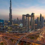 Dubai skyline at dusk with highways and nearby mixed use plots Dubai.